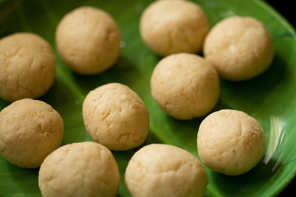 rasgulla on a green plate after removing sugar syrup from pressing