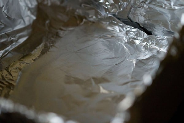 a square pan lined with aluminium foil.