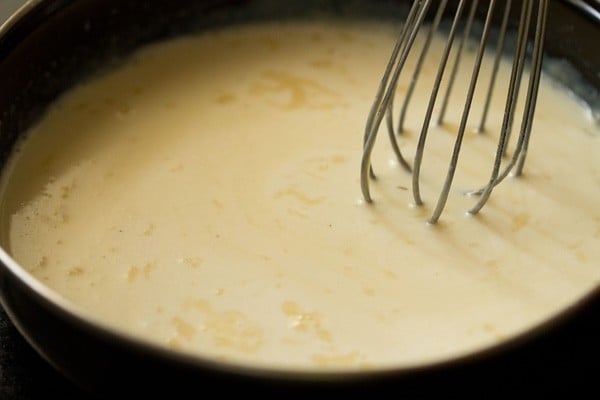 sugar being mixed with liquid mixture