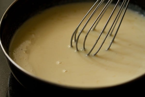 sugar being mixed with liquid mixture