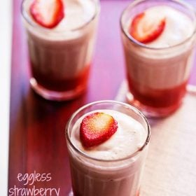 strawberry mousse garnished with fresh strawberry slices and served in three shot glasses with text layover.