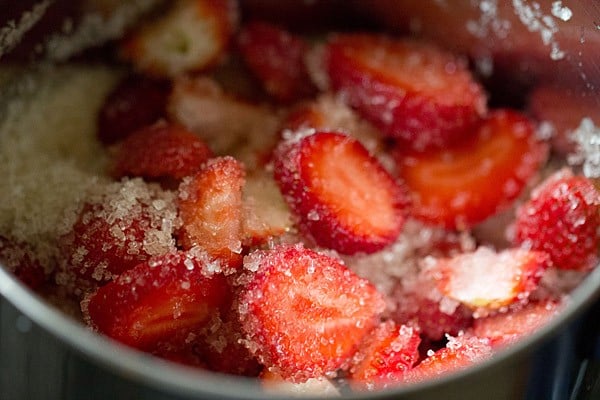 chopped fresh strawberries and sugar added to a blender jar. 