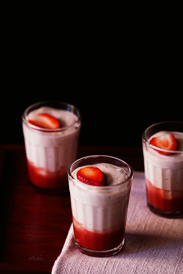 strawberry mousse garnished with strawberry slices and served in shot glasses. 