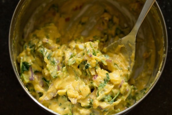 mixing to make methi pakora batter