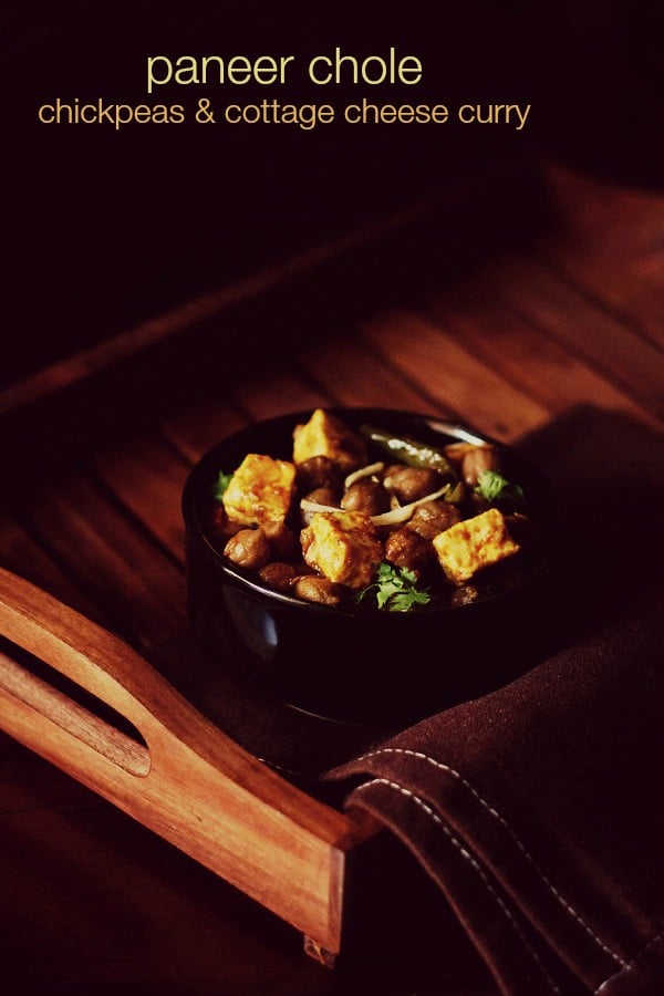 chole paneer served in a black bowl