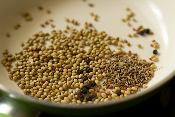 whole spices added to hot pan for dry roasting. 