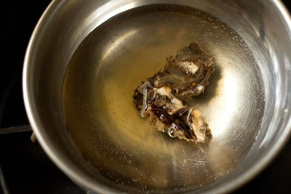 soaking seedless tamarind in hot water. 