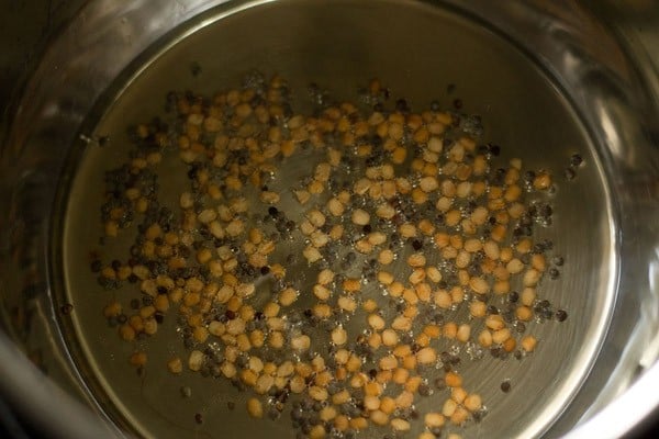 frying mustard seeds and urad dal in hot oil. 