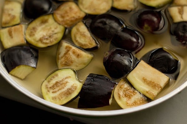 quartered brinjals soaked in salted water to make kara kulambu.