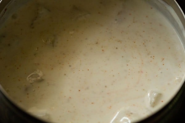 mixing spices with curd