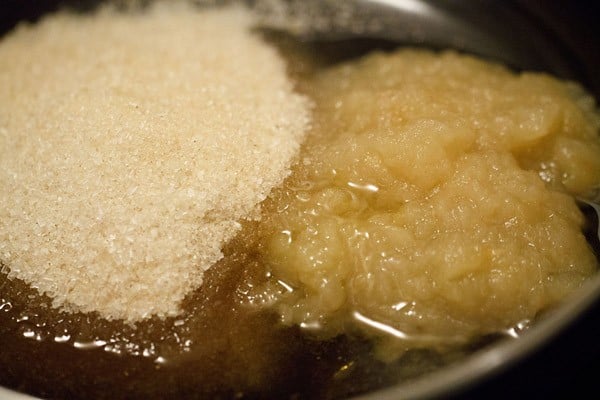 wet ingredients for applesauce cake recipe added to a bowl.