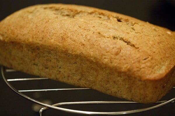 cooling vegan eggless applesauce cake on a wire rack.