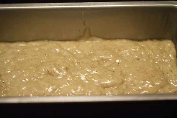 eggless applesauce cake batter in prepared loaf pan.