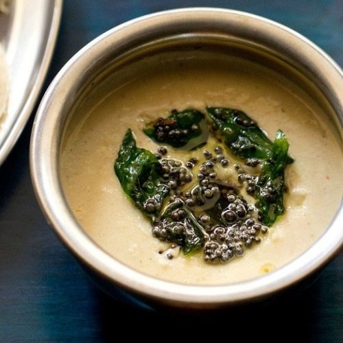 chana dal chutney served in a steel bowl.