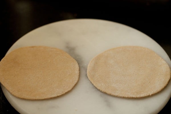 rolled cheese paratha on a board