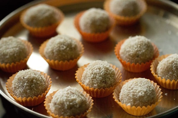 coconut ladoo in muffin liners in a plate