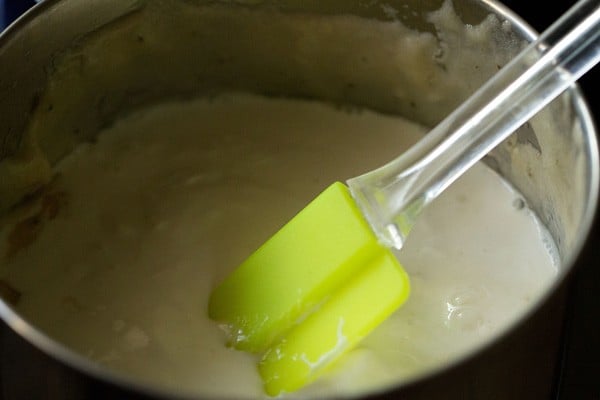 adding cream to the pureed banana mixture. 