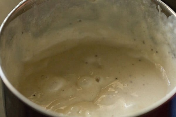 mixing the cream with the pureed banana mixture in the blender. 