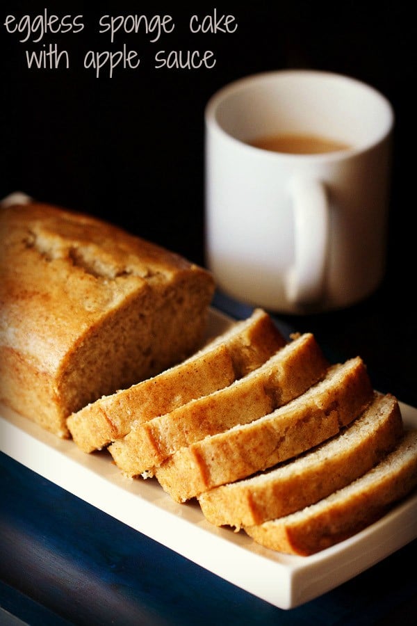 applesauce cake loaf with slices on white tray