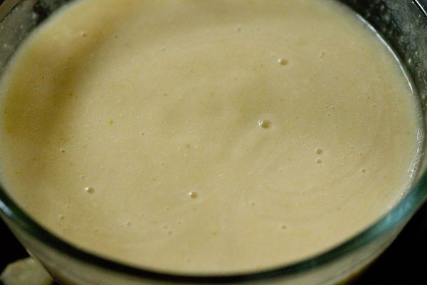 stirring the sugar in the guava juice drink. 