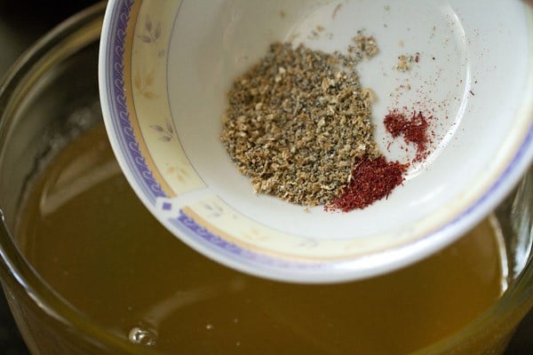 adding powdered spices to sugar-lemon solution