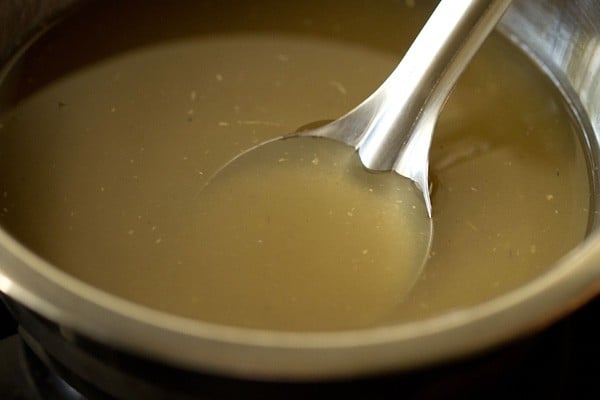 stirring sugar in pan for lemon squash