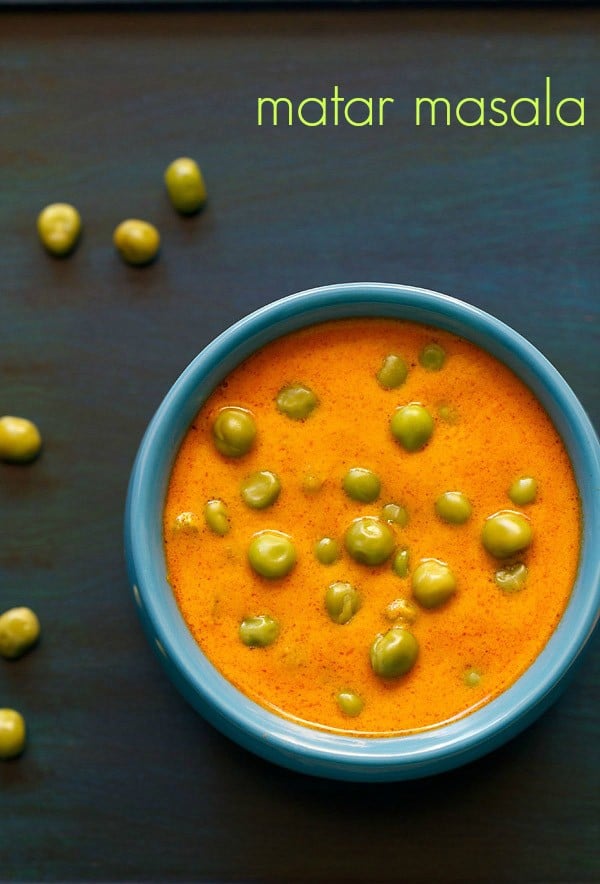 green peas masala served in a blue colored handi with fresh green peas kept on the side and text layover.