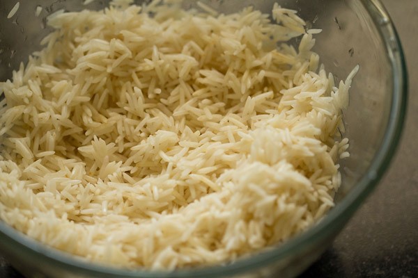 soaked rice with all water removed in glass bowl