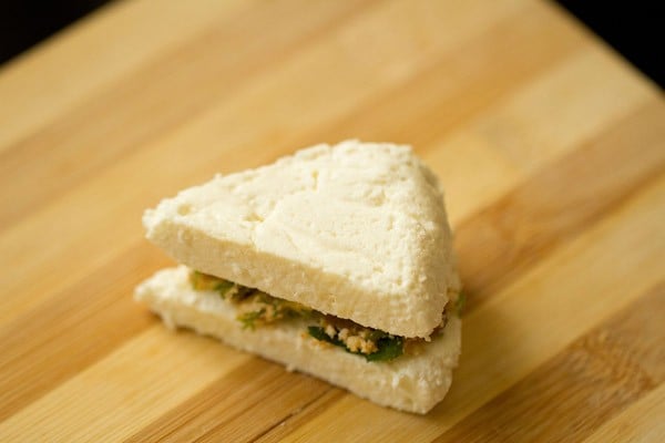 stuffed paneer sandwich on a cutting board