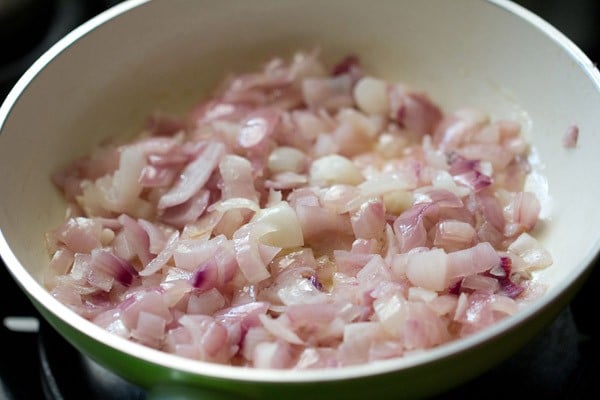 sautéing onions in a pan