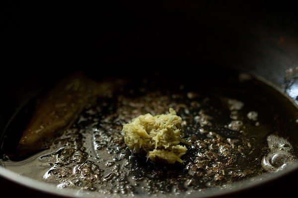 ginger paste added to pan with spices and oil