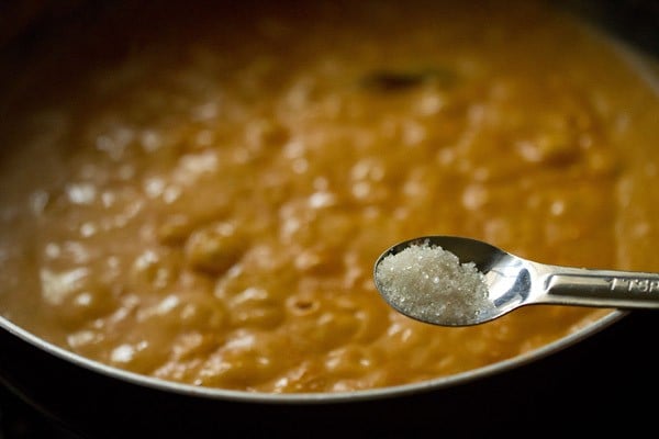 salt above pot of paneer pasanda gravy