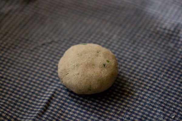 amaranth paratha dough ball on a wet cloth
