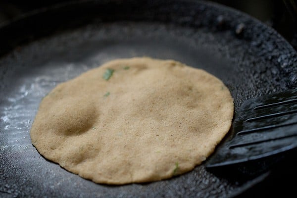 frying amaranth paratha