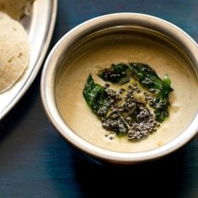 chana dal chutney served in a steel bowl.