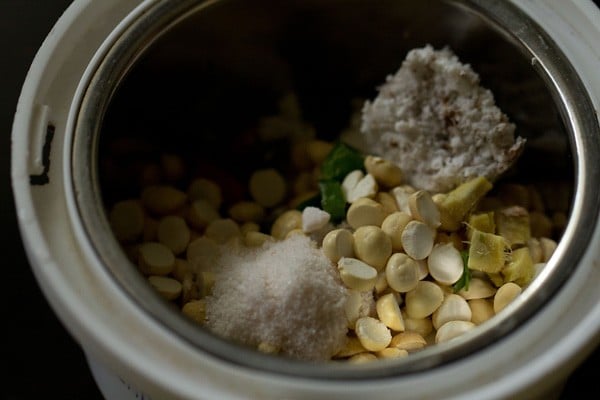 roasted chana dal, grated fresh coconut, chopped ginger, chopped green chilies and salt added to a grinder jar. 