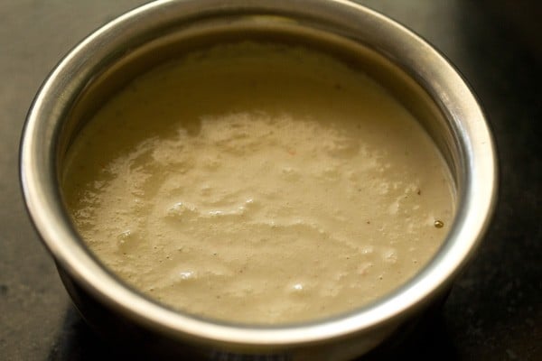 roasted chana dal chutney added to a bowl. 