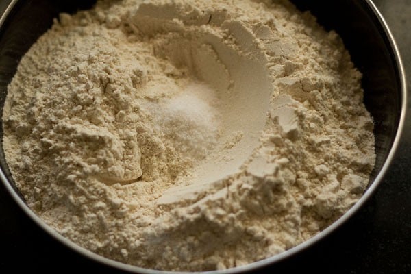 atta flour and salt in a bowl.