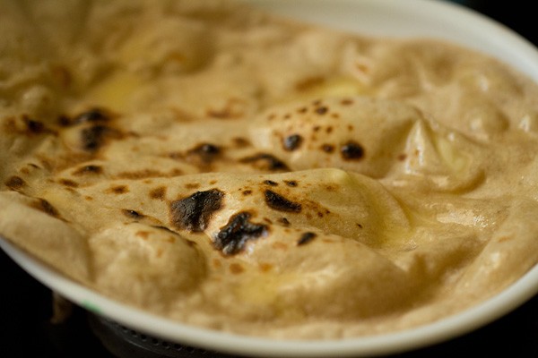 brushed butter on tandoori roti.