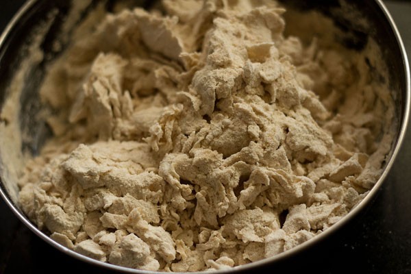 gathering dough for tandoori roti recipe - it looks dry and flaky at the moment.