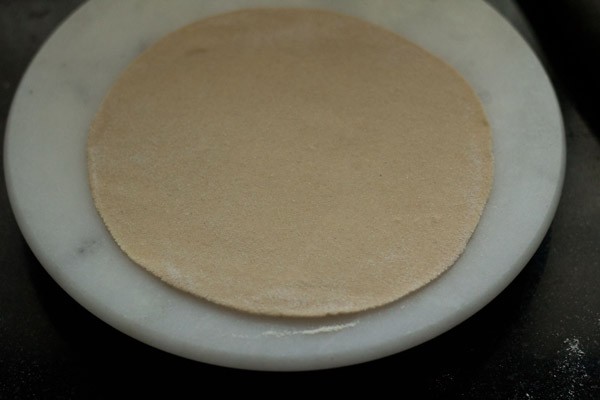 rolling dough to a circle.