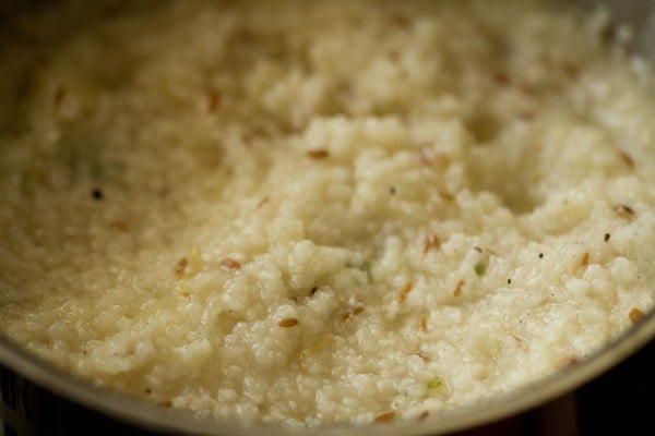 garnishing cooked samvat rice khichdi in the pot