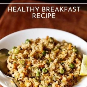 oats upma with a lemon wedge and a spoon served on a white plate on a brown board with text layovers.