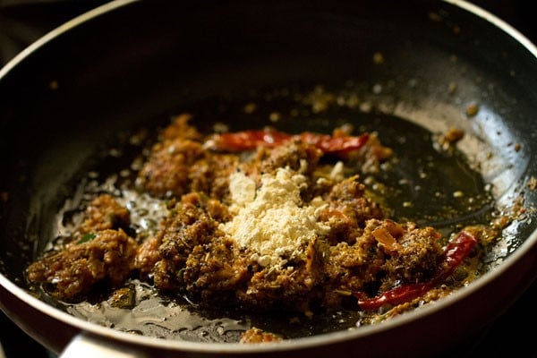 besan added to pan with other achari masala ingredients