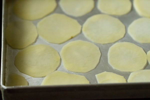 Bake the potato chips in a single layer on an oiled baking sheet.