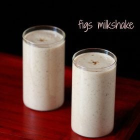 fig milkshake served in 2 tall glasses with text layover.