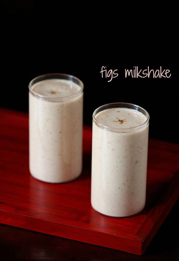 fig milkshake served in 2 tall glasses with text layover.