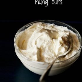 hung curd or greek yogurt served in a bowl with a spoon in it and text layover.