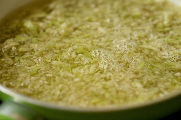 grated lauki and water in a pan