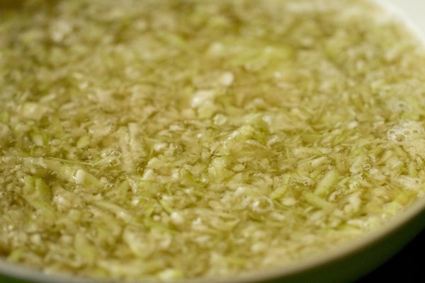 cooking lauki in water in a pan